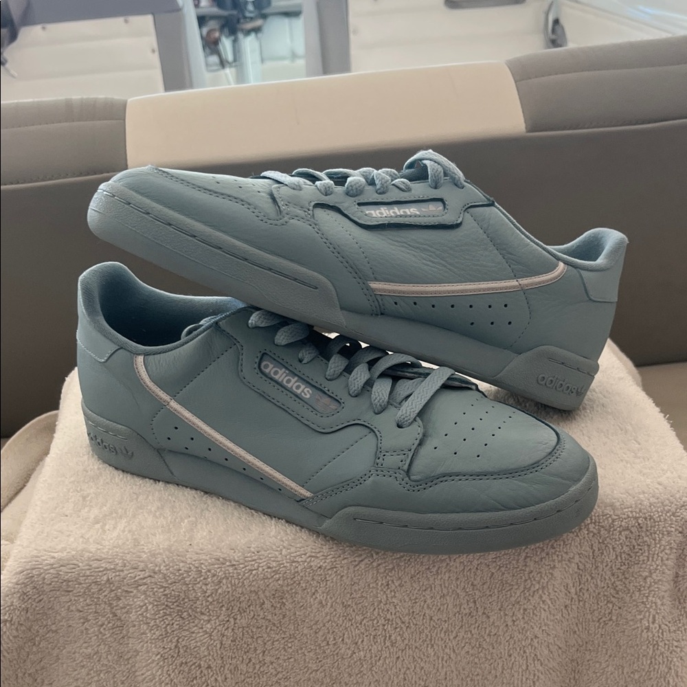 This is an Adidas Continental 80 sneaker in the Ash Grey colorway